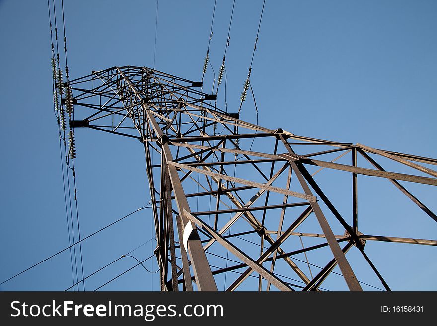 High-voltage power lines against the sky. Industrial background for appropriate purposes