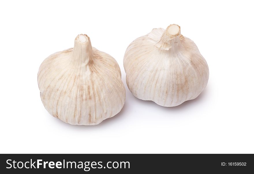 Aromatic, fresh garlic on a white background. Aromatic, fresh garlic on a white background.