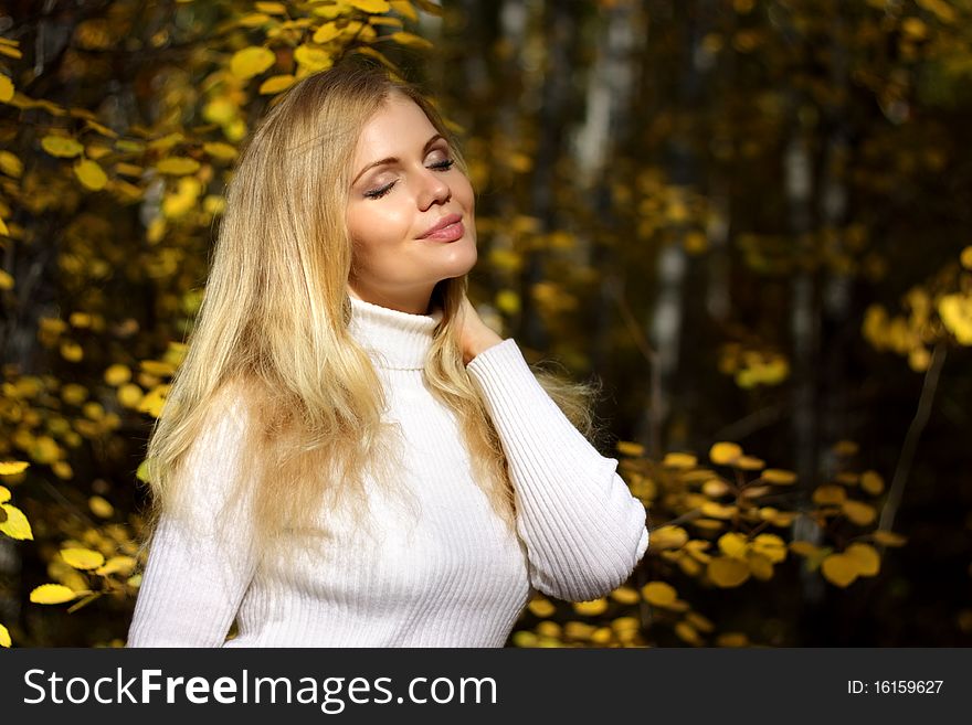 Girl in the autumn forest