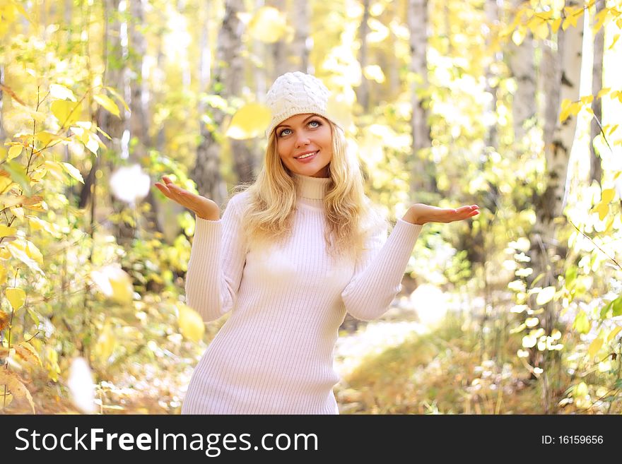 Attractive girl in the autumn forest
