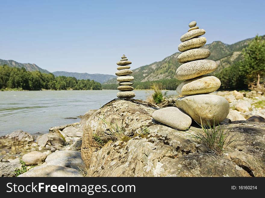 Balanced stones on the sea