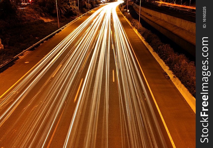 A long exposure image of a highway traffic. A long exposure image of a highway traffic