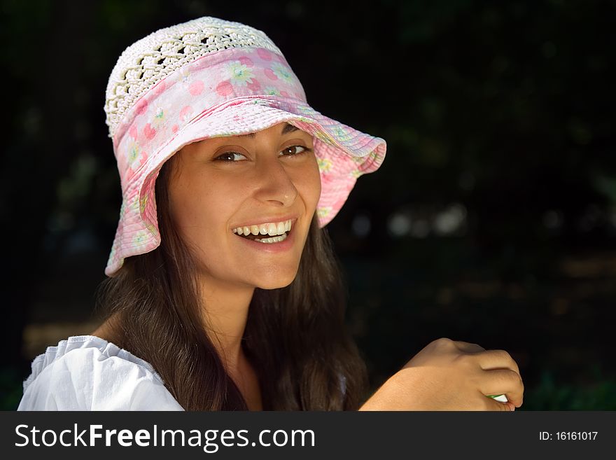 Portrait of a young pretty  laughing girl in the bonnet. Portrait of a young pretty  laughing girl in the bonnet