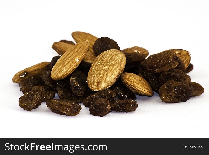 Mix of raisinsand almond nut on isolated background. Mix of raisinsand almond nut on isolated background