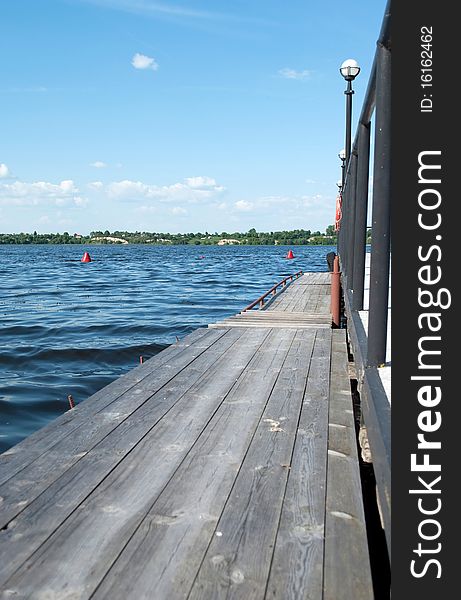 View from the pier on a blue lake