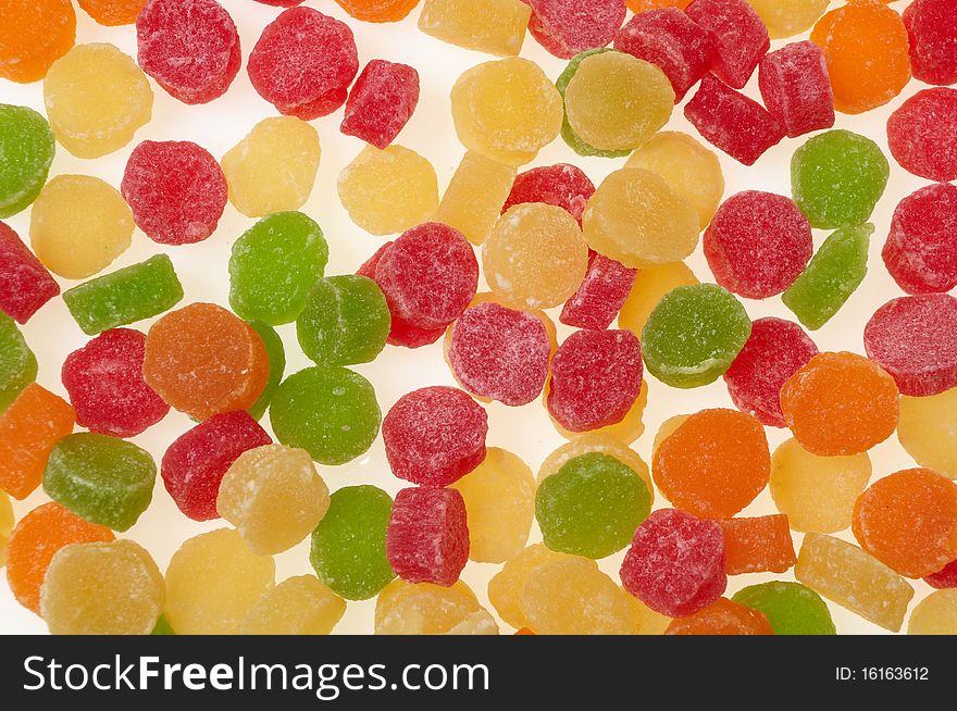 Pineapple chunks isolated on white. Candied fruits.