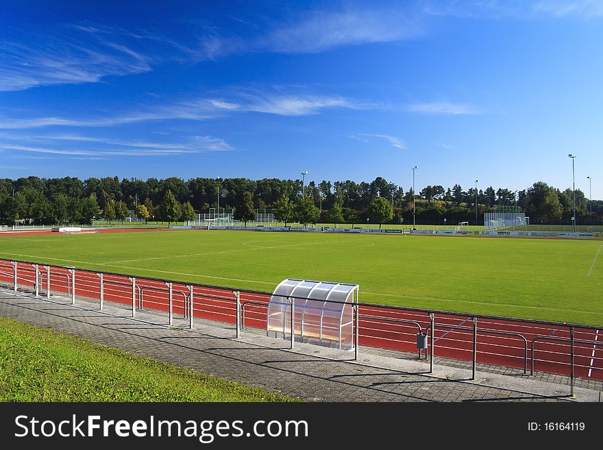 Green football field with red athletic field