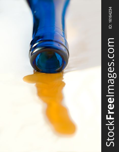 Part of a wine bottle from dark blue glass on a white background. Part of a wine bottle from dark blue glass on a white background