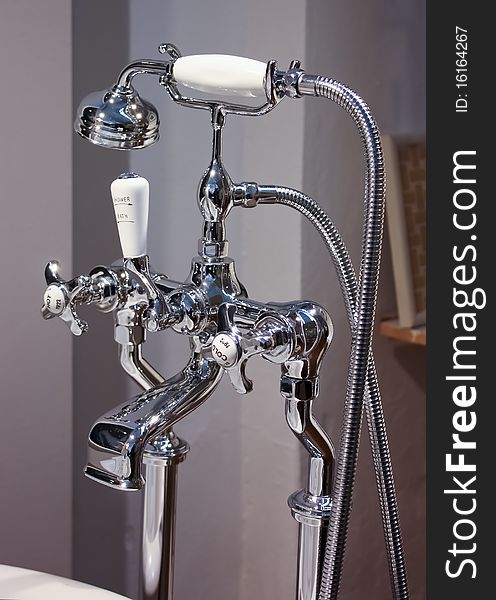 A beautiful chrome tap with white handle