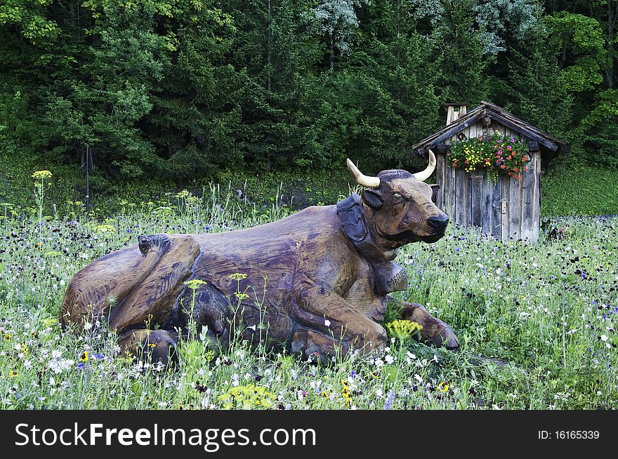 On the way to the Vanoise National Park, a roundabout on the road with wooden figures.