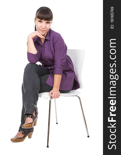 Young adult woman sitting on chair. over white background. Young adult woman sitting on chair. over white background