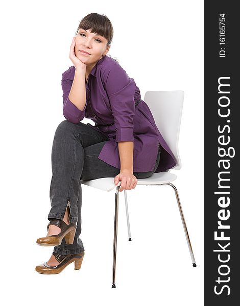 Young adult woman sitting on chair. over white background. Young adult woman sitting on chair. over white background