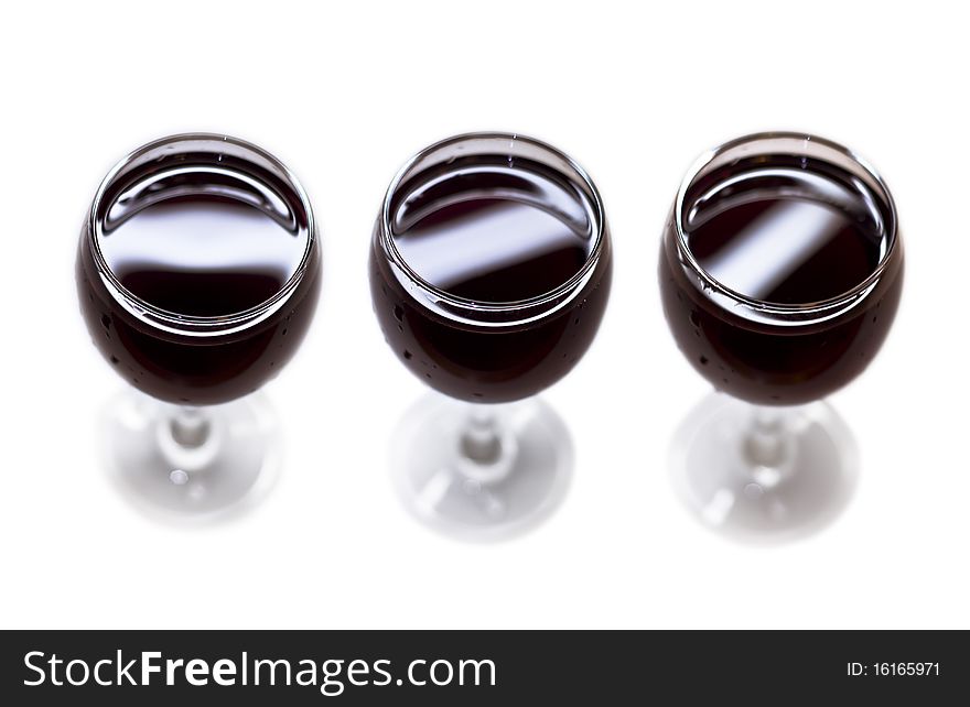 Three glasses of red dry wine. Isolated on white background.