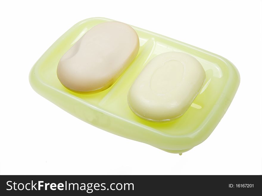 Two scented soaps with rack on white