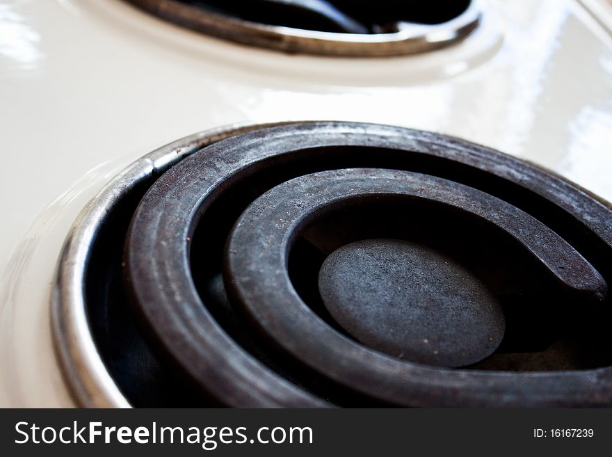 White old stove shot on top with two hot plates