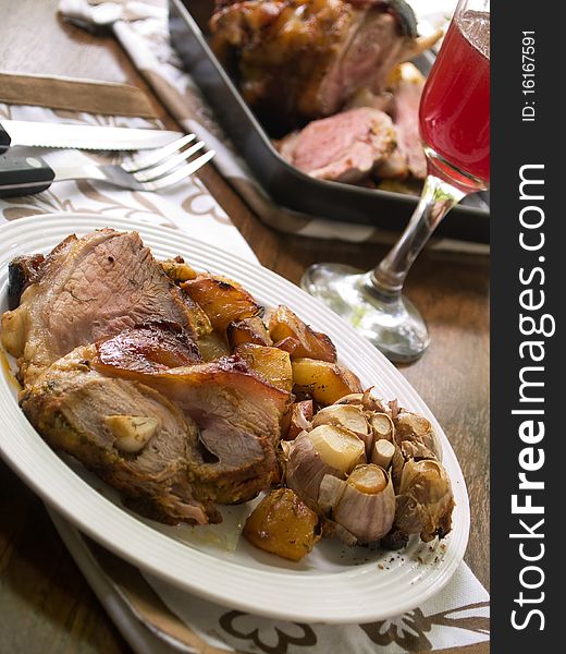 Delicious roasted pork knuckle with baked potatoes