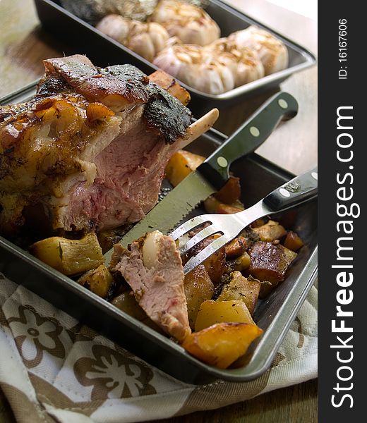 Delicious roasted pork knuckle with baked potatoes