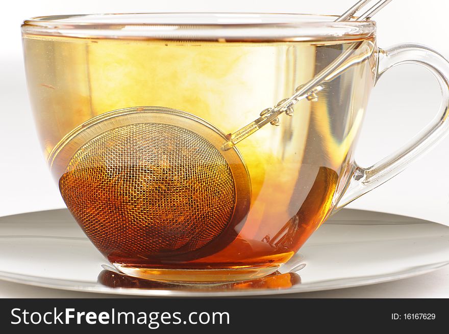 Antioxidant rich healthy herbal rooibos tea from the Western Cape region in South Africa, brewing in a cup. Antioxidant rich healthy herbal rooibos tea from the Western Cape region in South Africa, brewing in a cup.