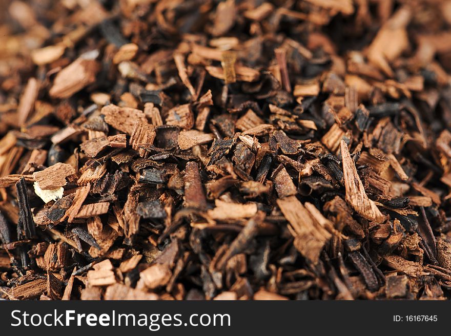 Macro studio shot of dry antioxidant rich healthy herbal rooibos honeybush tea from the Western Cape region in South Africa. Macro studio shot of dry antioxidant rich healthy herbal rooibos honeybush tea from the Western Cape region in South Africa.