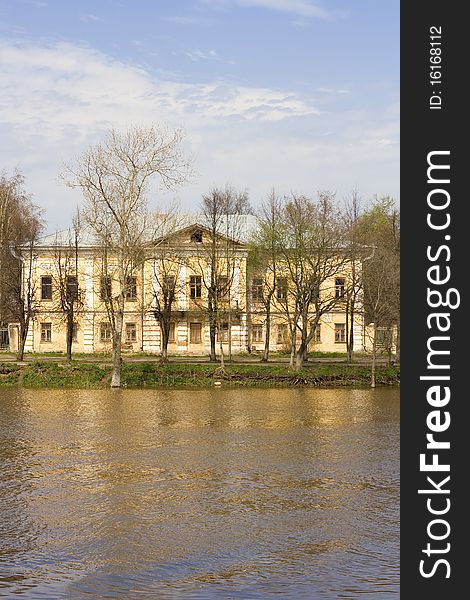 Historic house on river in small city (Vologda, Russia)