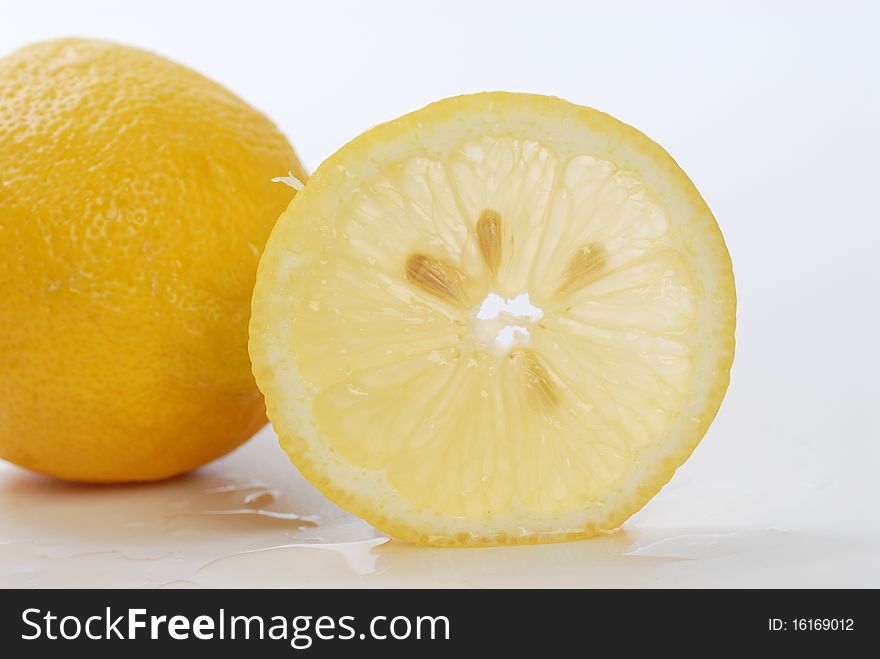 Yellow lemon isolated on white
