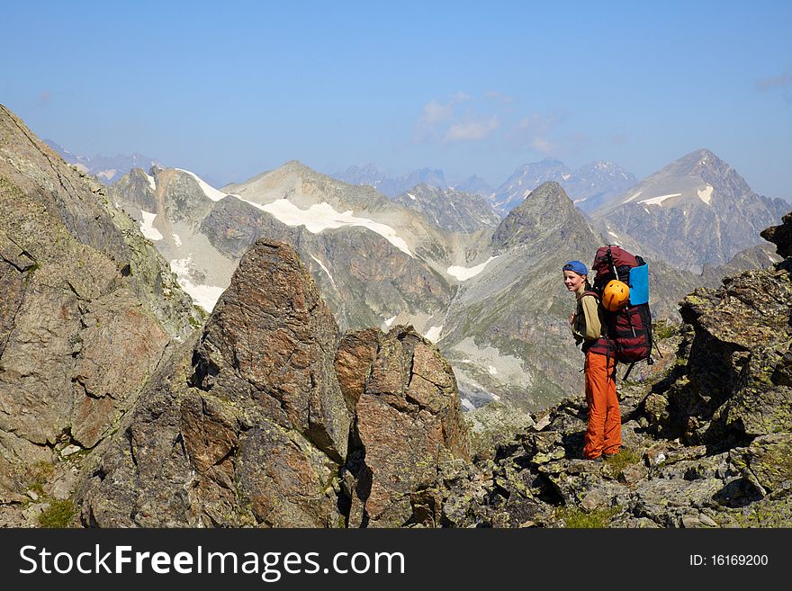 Backpacker girl in a mountains