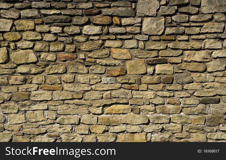 Old wall made of stone. Old wall made of stone