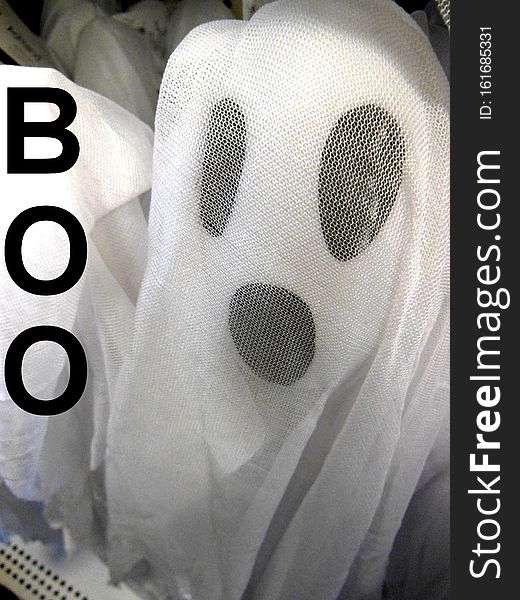 Halloween ghost with a Big Boo.  Black and White ghost with big eyes and nose.