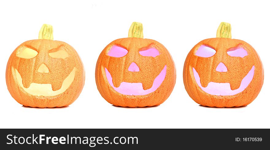 Three Halloween pumpkins isolated studio cutout