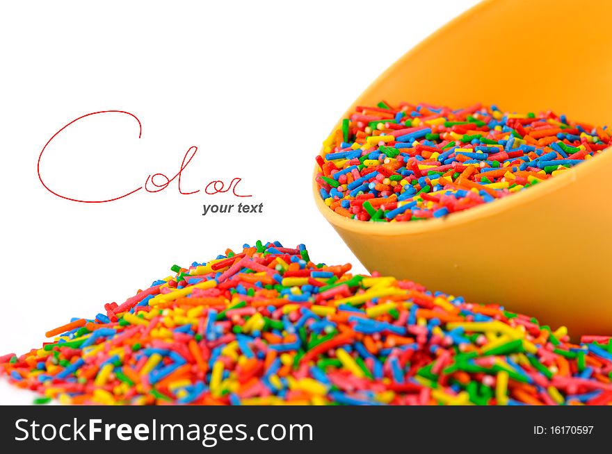 The colored candies on white background