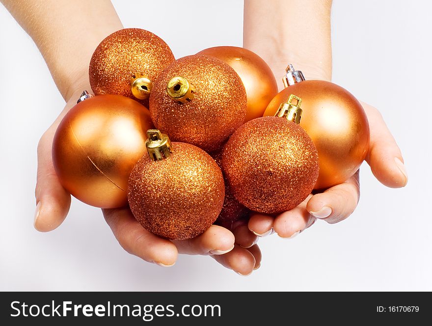 Female hands with the Christmas brightly spheres. Female hands with the Christmas brightly spheres