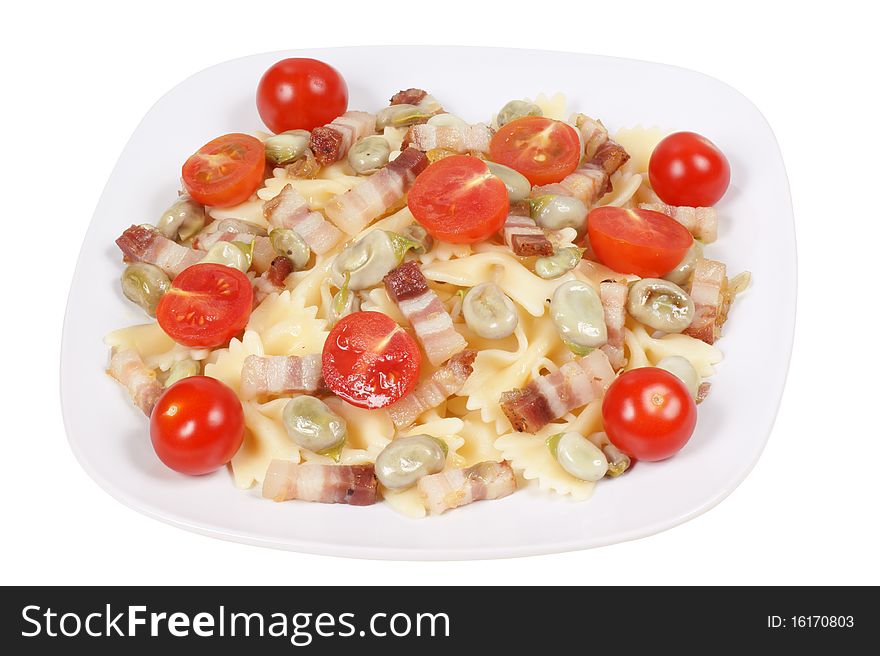 Italian pasta: farfalle with broad beans, smoked bacon and cherry tomatoes. Studio shot. Isolated on white with clipping path.