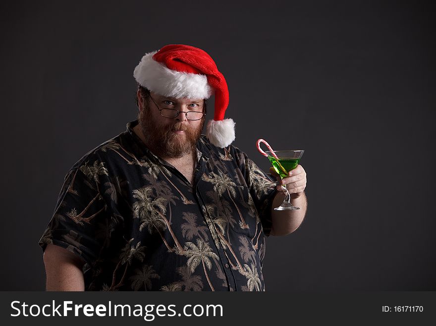 An obese man in Santa hat and tropical shirt