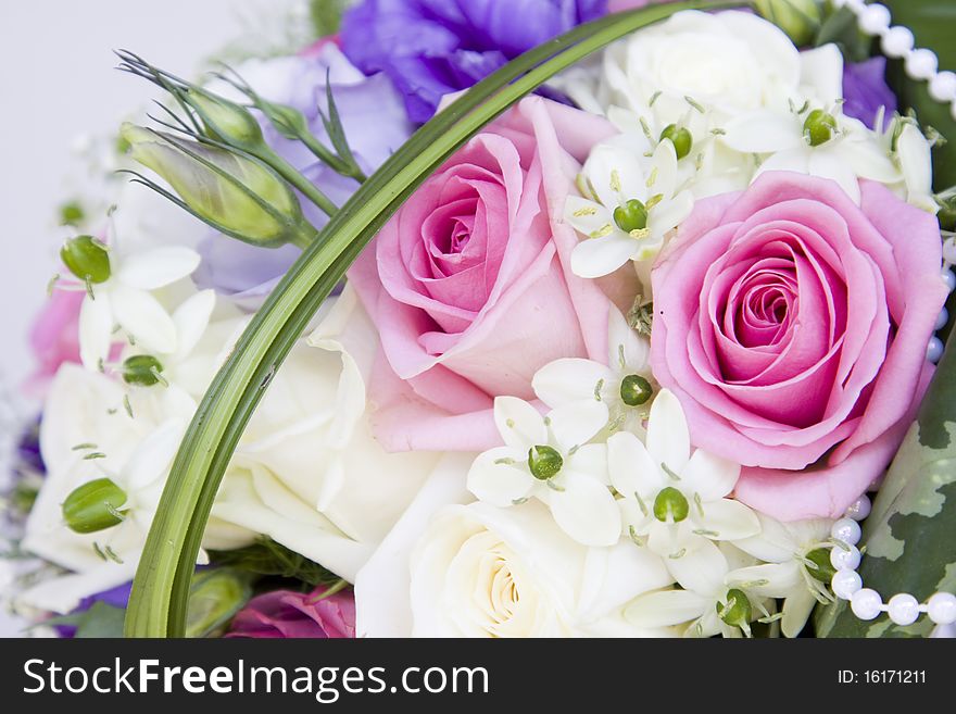Colorful wedding bouquet with pink and white roses