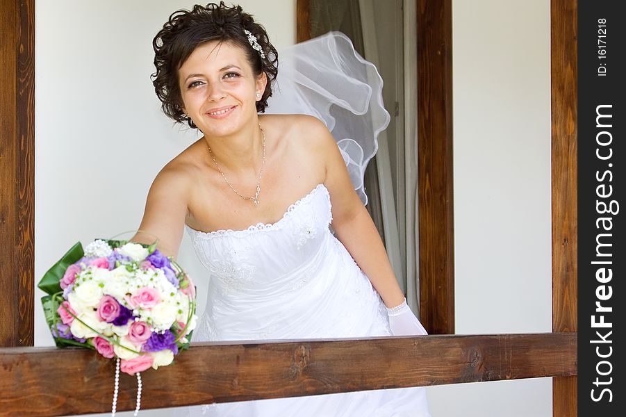 Portrait of the beautiful bride with bouquet