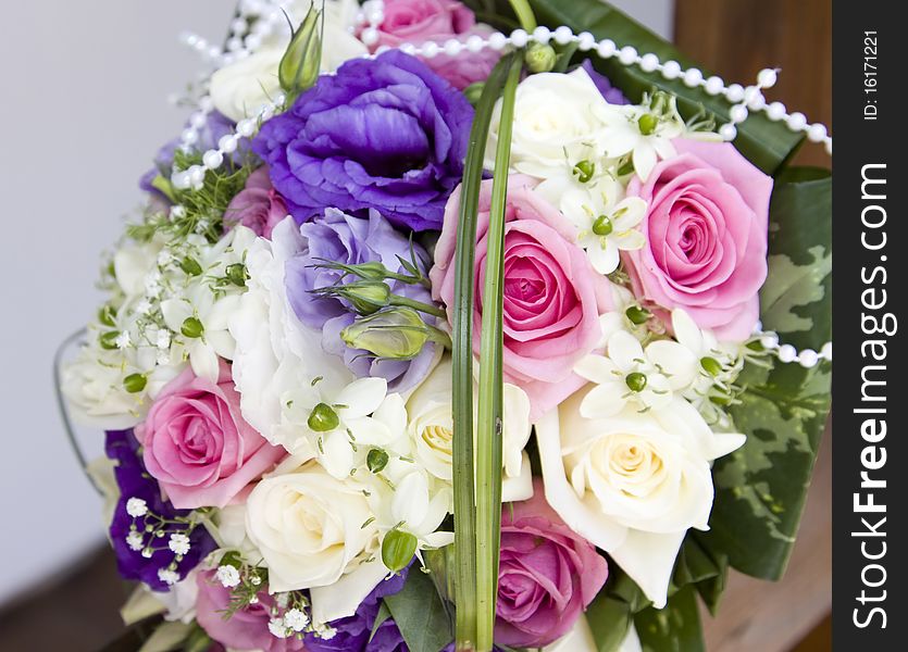 Colorful wedding bouquet with pink and white roses