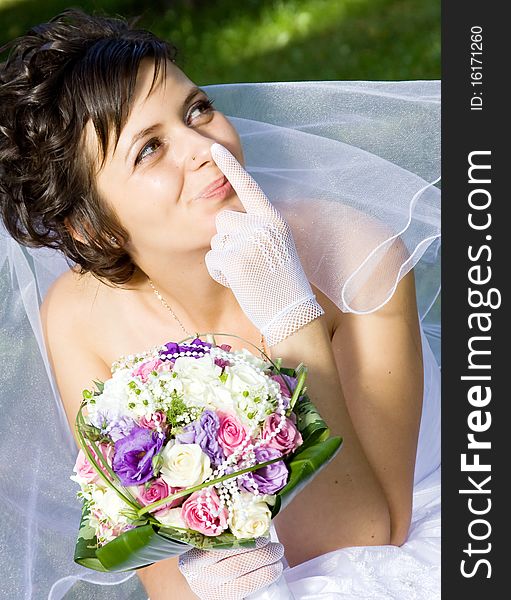 Portrait of the beautiful bride with bouquet