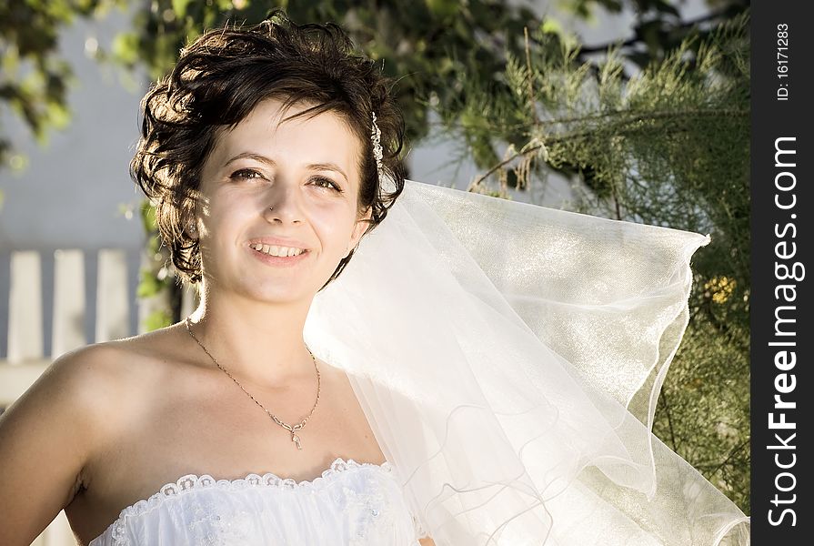 Portrait of the beautiful bride with bouquet