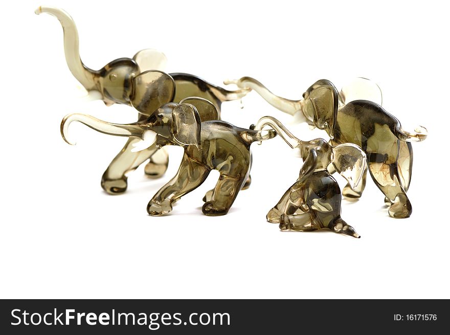 Four figurine elephants isolated over white background