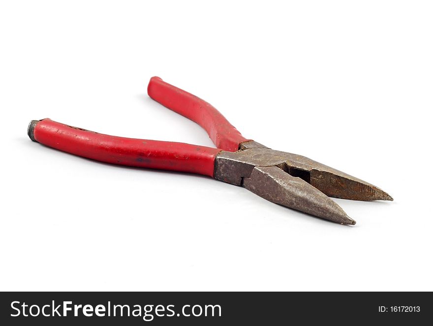 Old Pliers with red handles on a white background