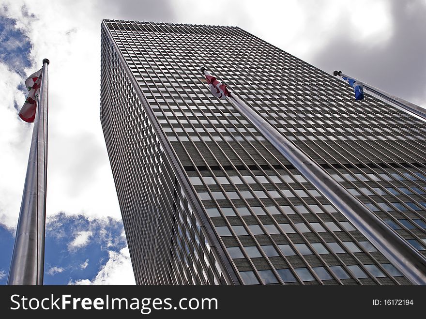 Modern highrise office building with flagpoles in Montreal, Quebec, Canada