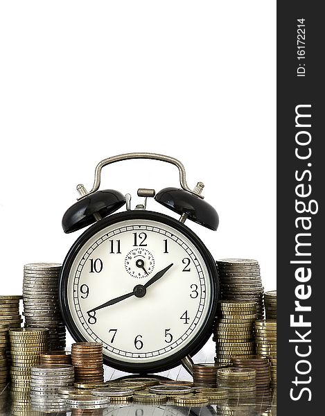 TIME IS MONEY Concept: Alarm Clock And Euro Coins