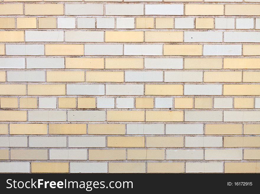 Yellow and white brick wall; in horizontal orientation