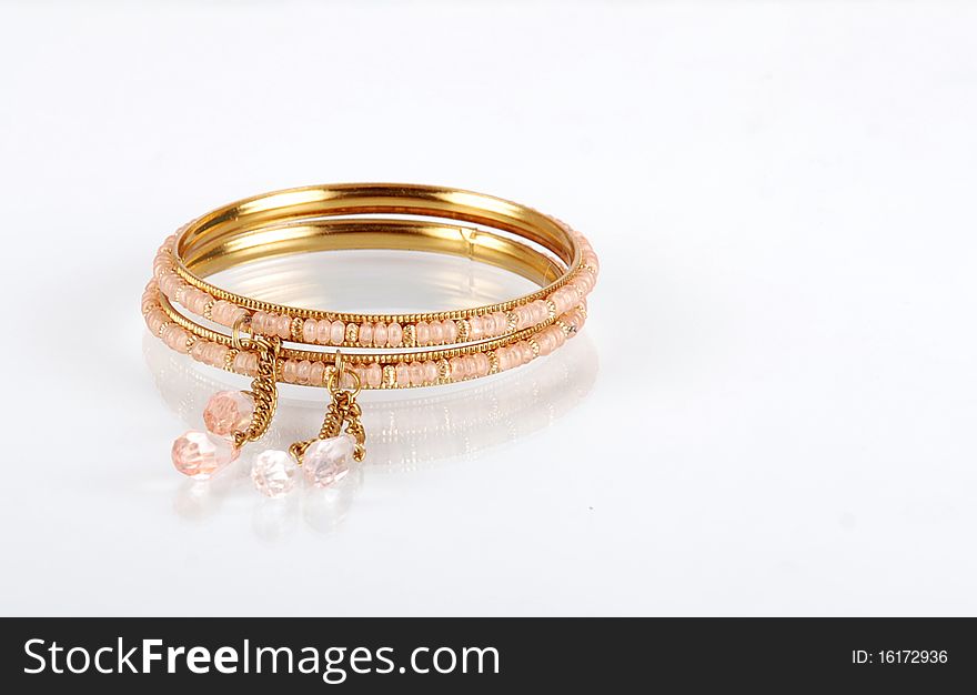 Beautiful golden bangles isolated on white