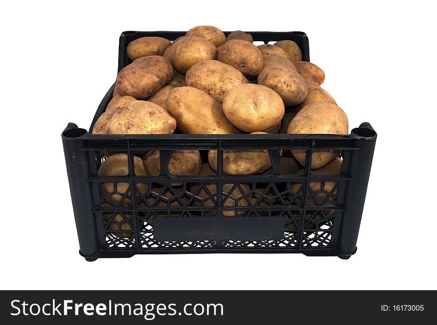 The box or tray of  bright yellow potatoes isolated over white. The box or tray of  bright yellow potatoes isolated over white