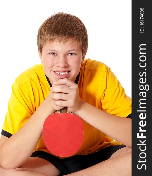 Portrait of handsome teenage in yellow T-shirt with ping pong rocket