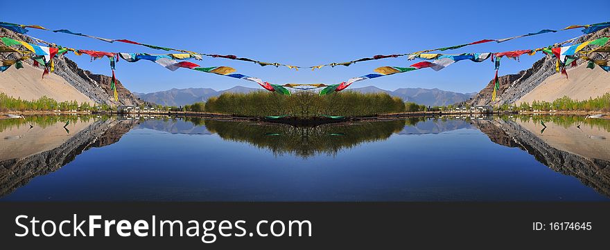 Reflection of the lake with Tibetan's flag