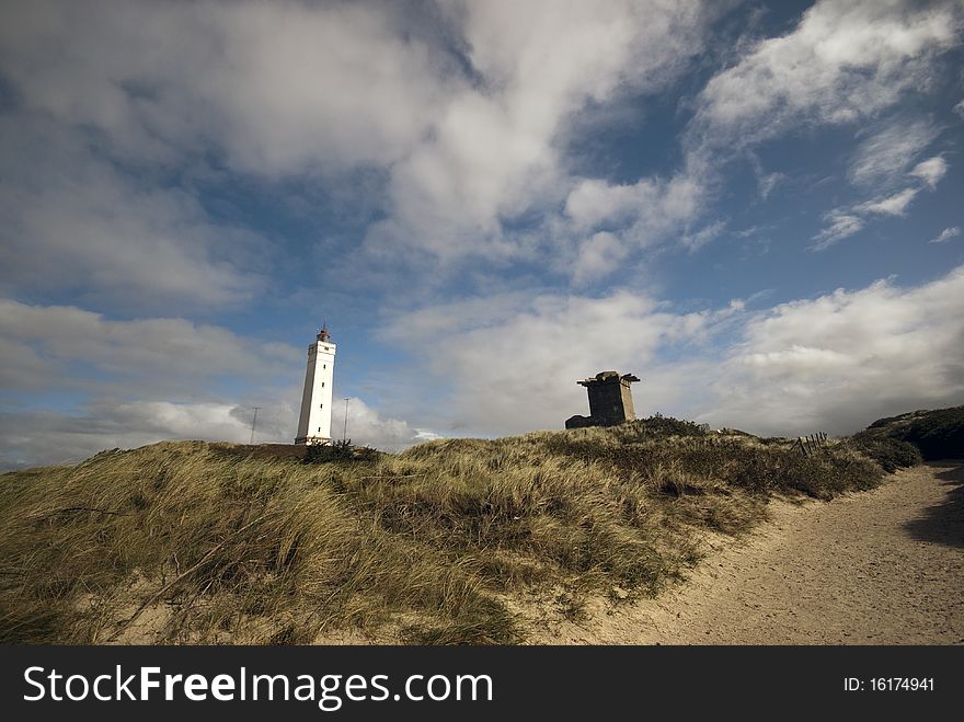 Blaavandshuk lighthouse is situated at Denmark's westernmost point and is a landmark for this area. Close to bunker from World War Two. Blaavandshuk lighthouse is situated at Denmark's westernmost point and is a landmark for this area. Close to bunker from World War Two.