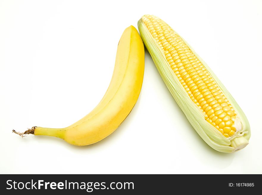 Sweet yellow corn and banana on white background