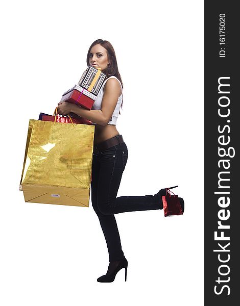 Pretty young woman with packages of purchases